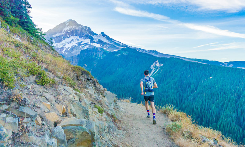 Trail runner wearing technical synthetic outdoor clothing