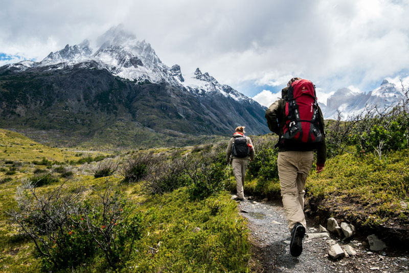 Hikers wearing base layers in cool mountain conditions